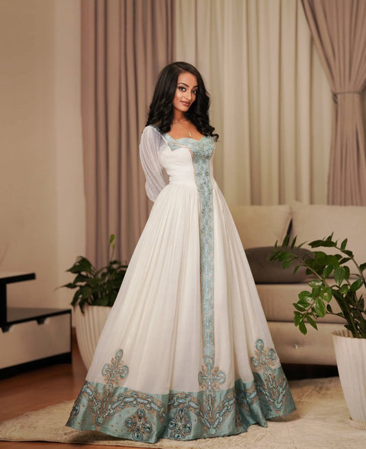 Modern Ethiopian Dress for Celebrations- Flowing White Habesha Dress with Green Tibeb-Inspired Gown yaab.habesha