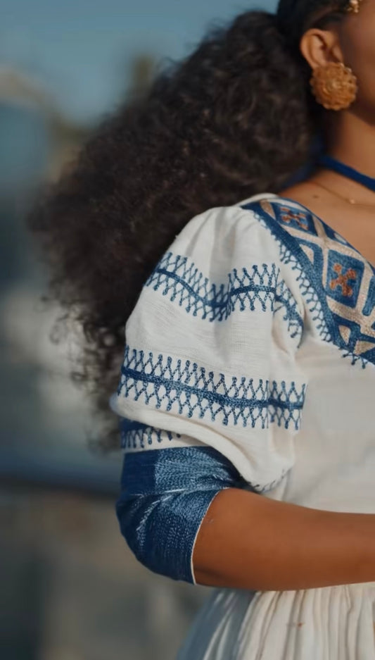 Unique White Habesha Dress by Liya Fetil – Blue Tilet Art & Gonder Faldas Cross Embroidery