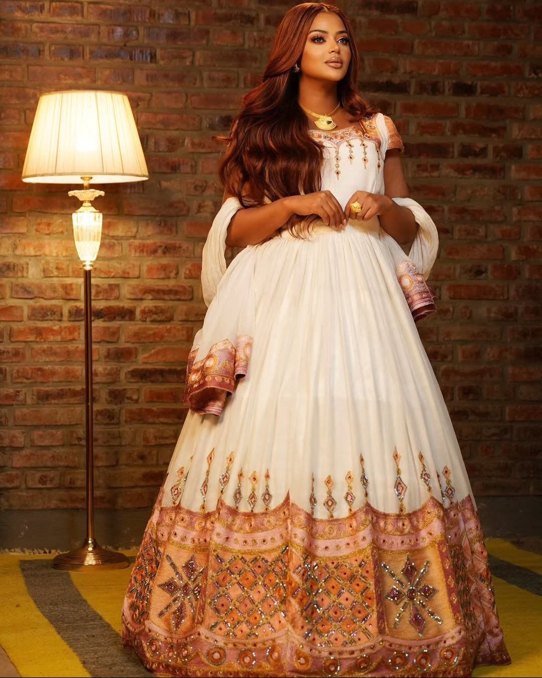 Luxury Ethiopian Occasion Dress – Beige Habesha Gown with Gold & Orange Beading Bezawit