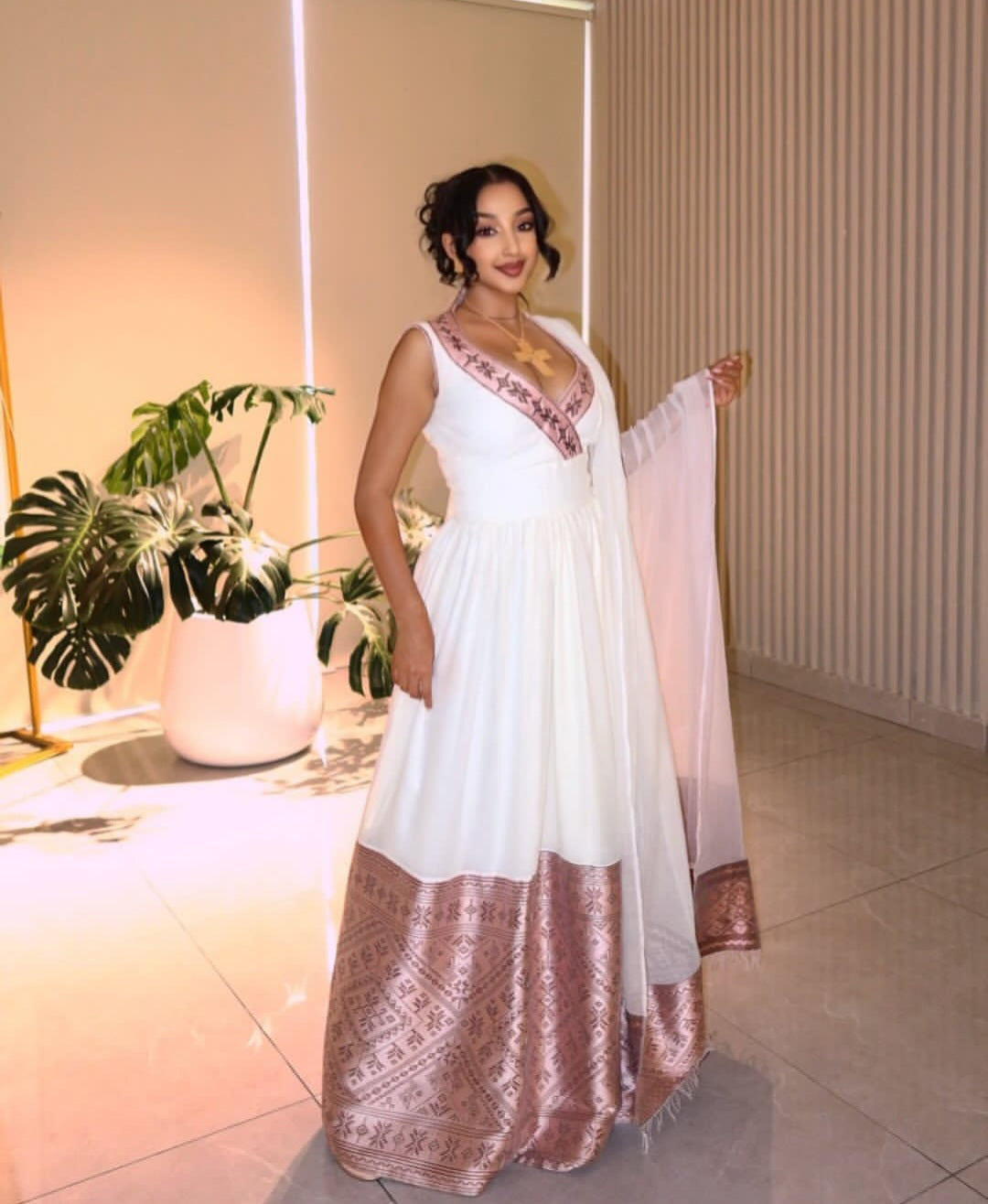 Rose Gold & White Sleeveless Modern Habesha Dress with Flowing Drape Rose Gold & White Sleeveless Modern Habesha Dress with Flowing Drape