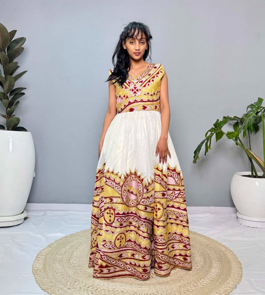 Golden Radiance: Sleeveless Habesha Dress with Pink & Red Accents Bezawit