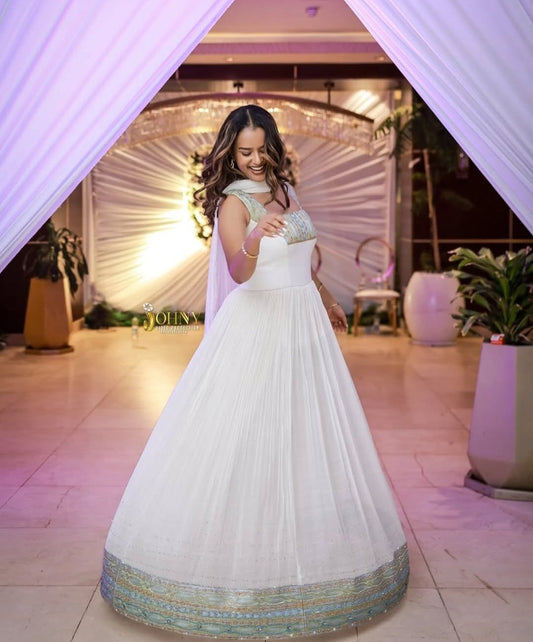 Modern Ethiopian Dress for Celebrations- Flowing White Habesha-Inspired Gown Bezawit