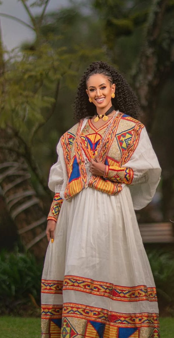 Ethiopian Dress – Elegant White Cotton with Orange Embroidery for Evening Galas