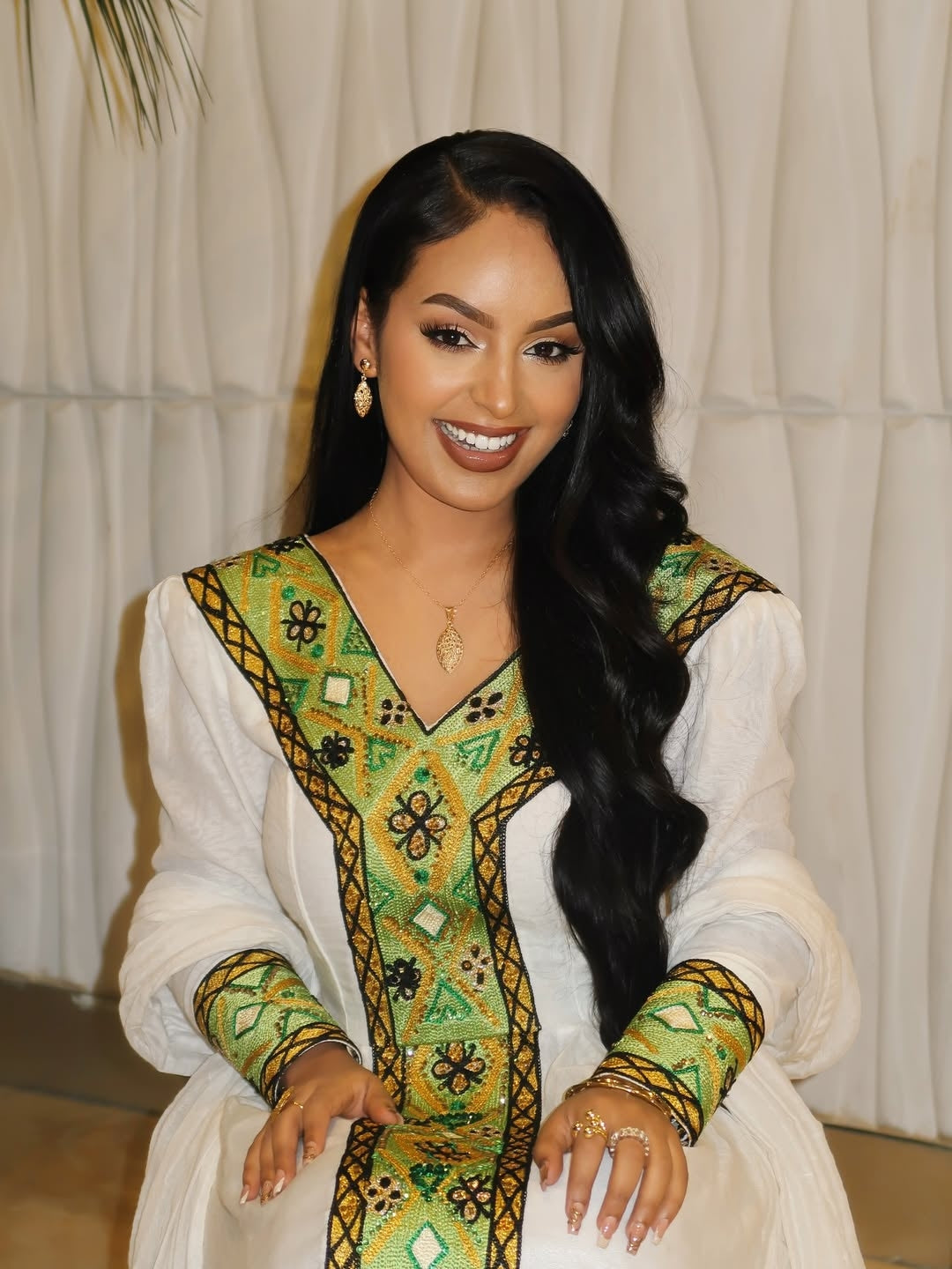 A Habesha model wearing an Ethiopian Dress
