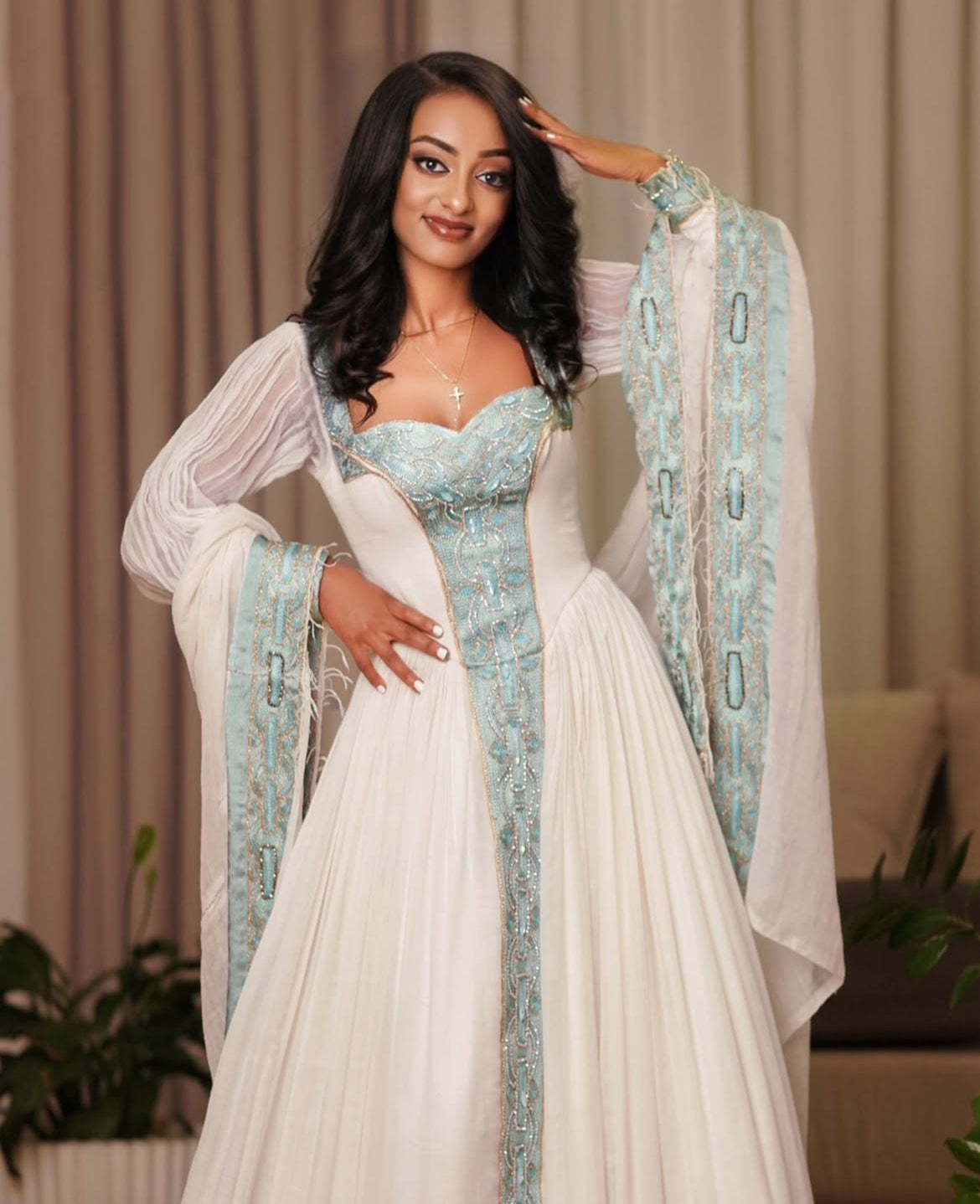 Modern Ethiopian Dress for Celebrations- Flowing White Habesha Dress with Green Tibeb-Inspired Gown yaab.habesha