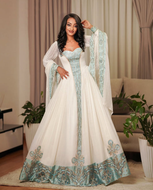 Modern Ethiopian Dress for Celebrations- Flowing White Habesha Dress with Green Tibeb-Inspired Gown yaab.habesha