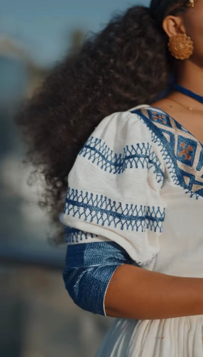 Unique White Habesha Dress by Liya Fetil – Blue Tilet Art & Gonder Faldas Cross Embroidery