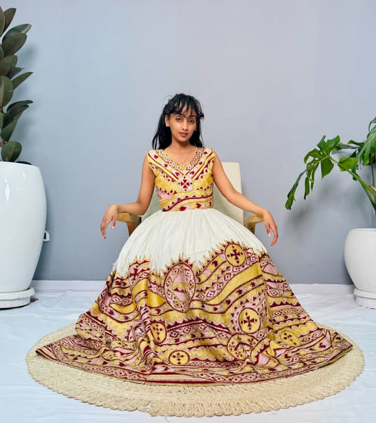 Golden Radiance: Sleeveless Habesha Dress with Pink & Red Accents