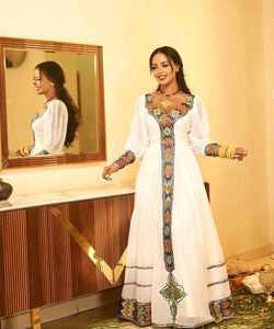 Elegant White Habesha Kemis - Modern Ethiopian Dress with Gold & Blue Embroidery Bezawit