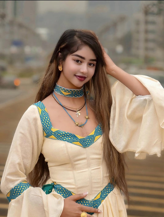 Habesha Dress – White Kemis with blue Embroidery for Cultural Festivals