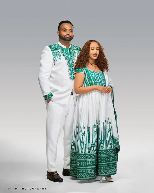 Man and woman in Ethiopian Wedding Dress attire with green and white patterns on a gray background