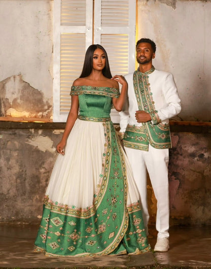Man and woman in formal Ethiopian Traditional matching couple outfit with green and white outfits standing in a rustic setting.
