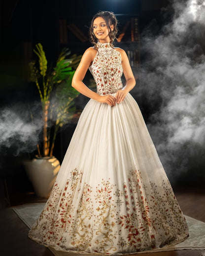 Woman in a floral evening Habesha dress  standing in a smoky indoor setting