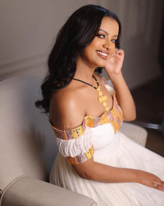 Habesha Dress – White off shoulder Style with Golden Yellow Borders for Meskel Festival