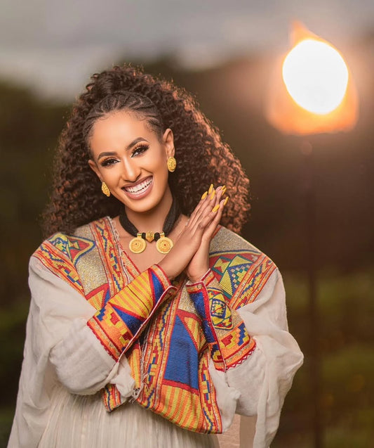 Ethiopian Dress – Elegant White Cotton with Orange Embroidery for Evening Galas