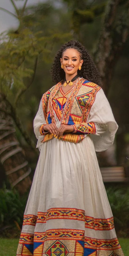 Ethiopian Dress – Elegant White Cotton with Orange Embroidery for Evening Galas