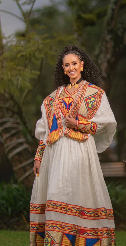 Ethiopian Dress – Elegant White Cotton with Orange Embroidery for Evening Galas
