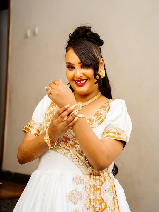 Habesha Kemis – Ivory Cotton Wedding Dress with Gold Embroidery