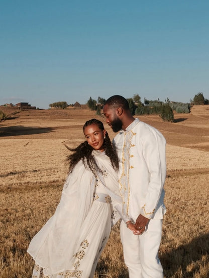 Couple in formal Matching couple Outfit set  standing in a field with a clear blue sky.