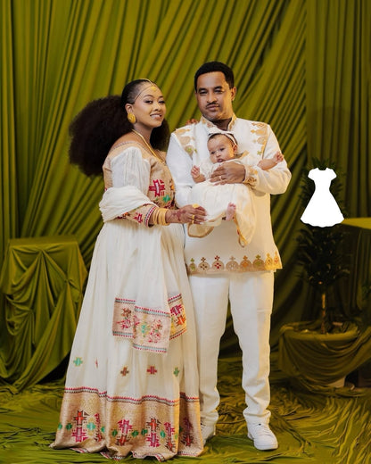 Family of three in formal Ethiopian Wedding Dress against a green curtain backdrop