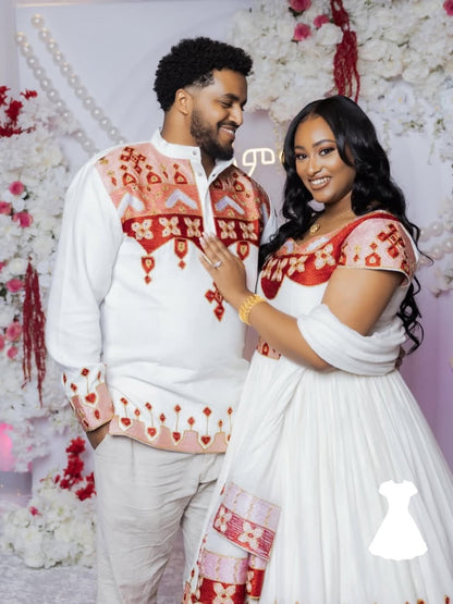 Couple in  Matching Habesha Outfit attire with a floral background