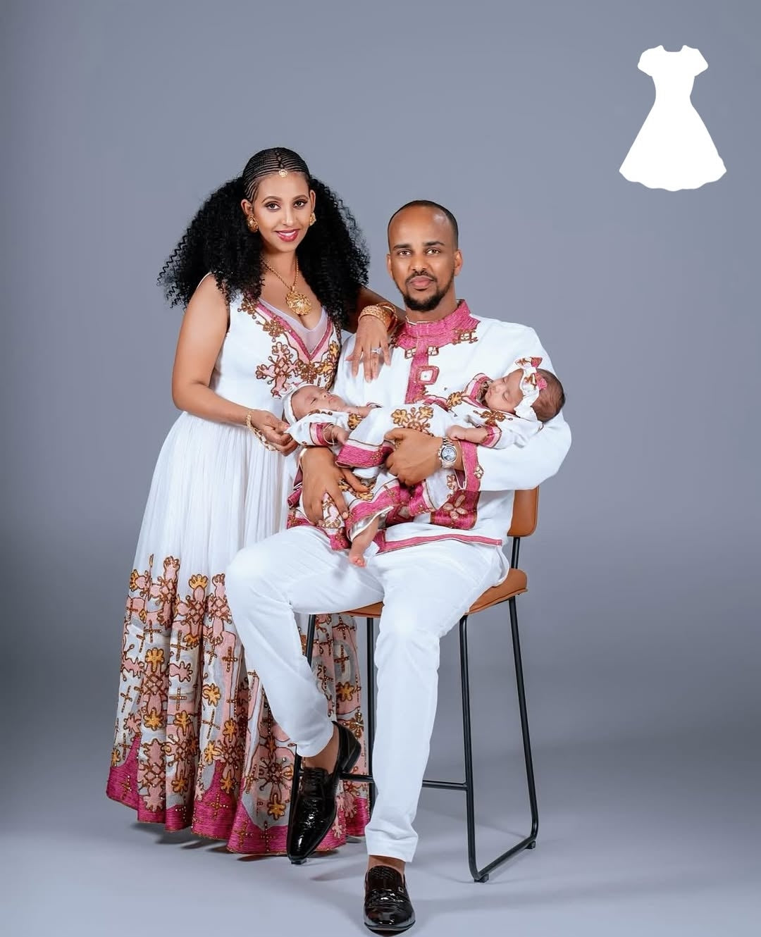 Family of three in matching Matching Couple Set with a gray background