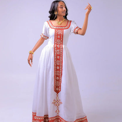 Red cotton Habesha dress finished with gold tilf embroidery for baptism celebrations