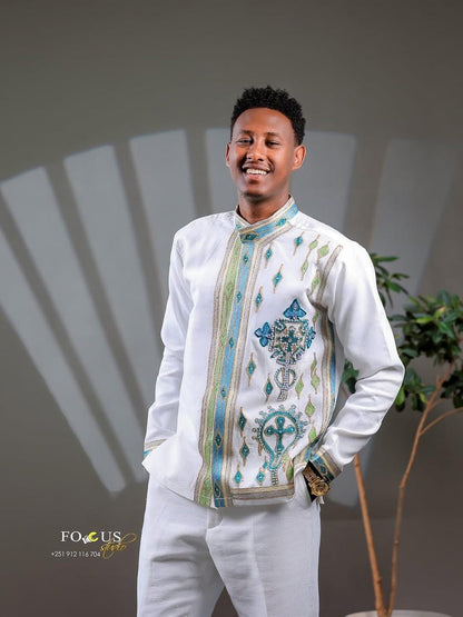 Man wearing a Habesha Men’s Cultural Shirt with a neutral background