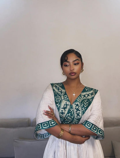 Green cotton Modern Habesha dress with silver embroidery for  special ocassions