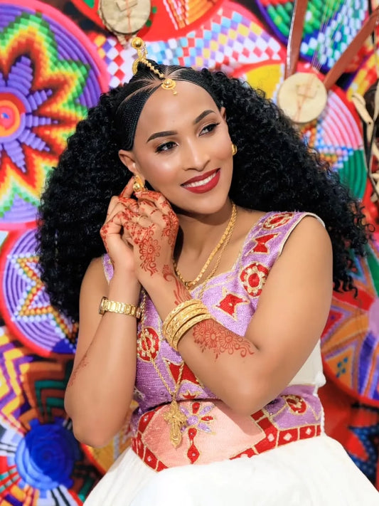 Woman in traditional Pink Ethiopian Traditional Dress with colorful background