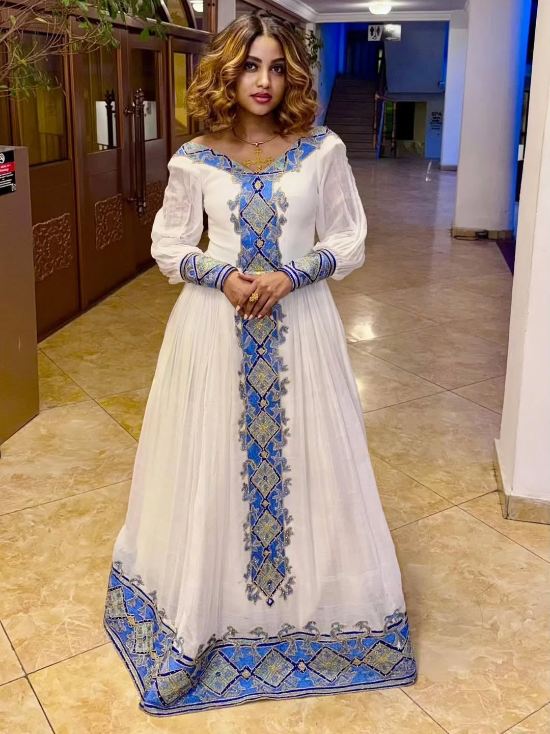 Elegant White Habesha Libs with Vibrant Blue Cross Design Tilf Embroid