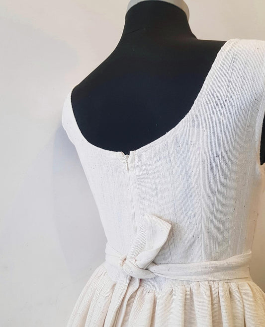 White Ethiopian Outfit on a mannequin against a plain background