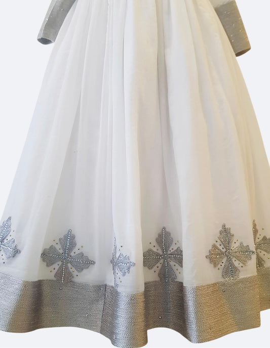 White tulle skirt with silver embroidered motifs and a metallic silver Ethiopian Outfit, shown against a plain light background.