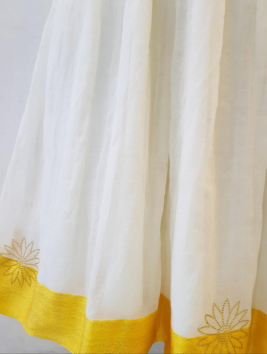 A close-up of a white Ethiopian outfit , likely a dupatta or scarf, featuring a vibrant yellow border at the bottom and matching yellow embroidered floral motifs near the lower edges.