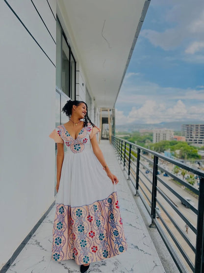Modern Pink Habesha Zuria – V-Neck Ethiopian Dress with Colorful Tibeb and Flowing Shemma Skirt for Special Occasions