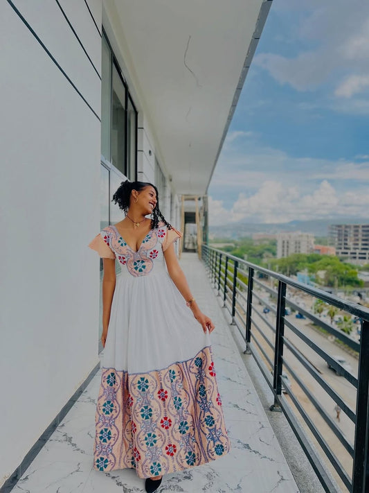 Modern Pink Habesha Zuria – V-Neck Ethiopian Dress with Colorful Tibeb and Flowing Shemma Skirt for Special Occasions