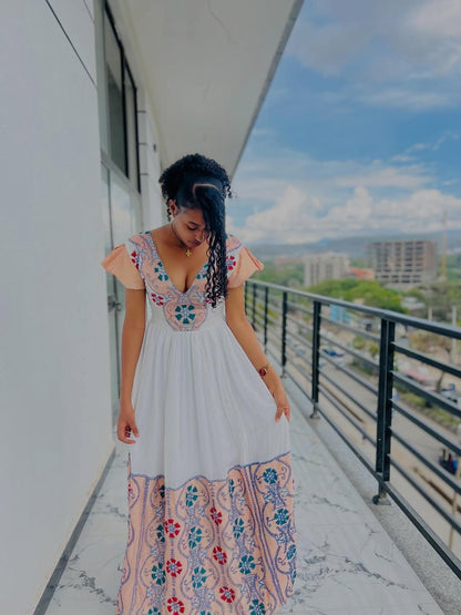 Modern Pink Habesha Zuria – V-Neck Ethiopian Dress with Colorful Tibeb and Flowing Shemma Skirt for Special Occasions