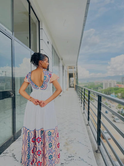 Modern Pink Habesha Zuria – V-Neck Ethiopian Dress with Colorful Tibeb and Flowing Shemma Skirt for Special Occasions