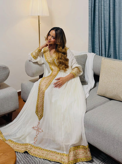 Yellow Habesha dress for graduation day with a bright color and traditional embroidery