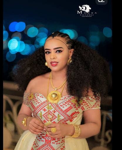 Woman in traditional Habesha Wedding Dress  with jewelry against a blurred bokeh background