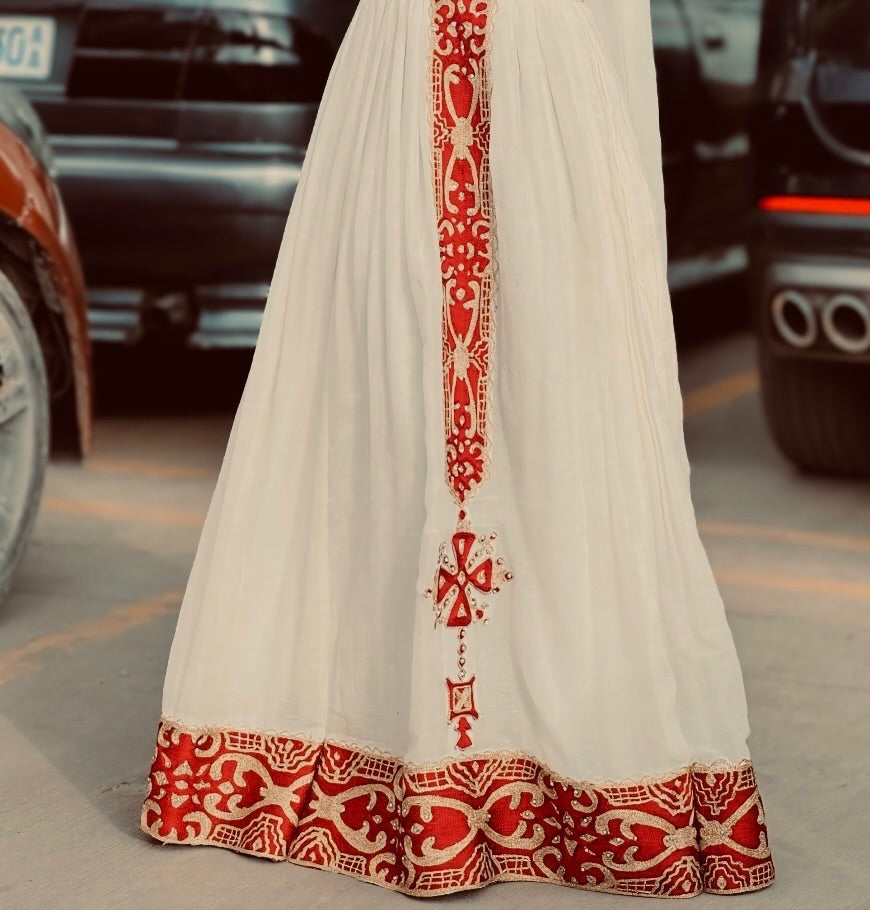 White garment with red Red Habesha Kemis on a street background