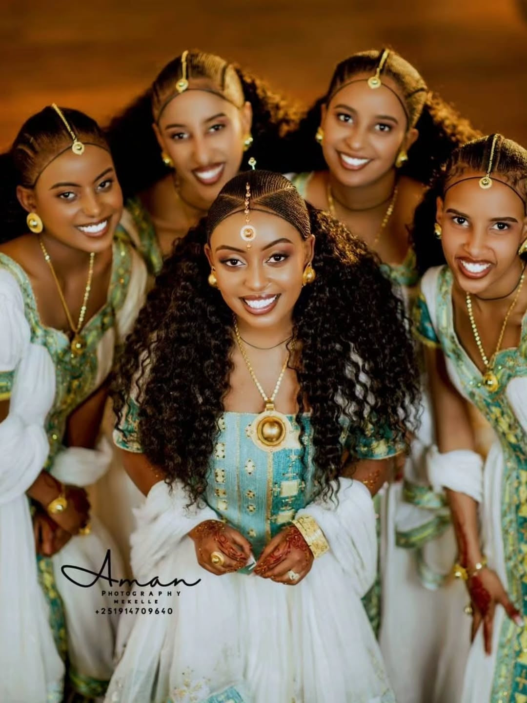Group of women in traditional Green Ethiopian Couple Matching Set with gold jewelry, posing together.