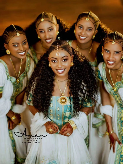 Group of women in traditional Green Ethiopian Couple Matching Set with gold jewelry, posing together.