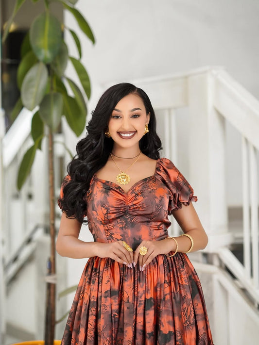 Orange Chiffon Habesha Dress – Flowing Ethiopian dress with Elegant Hand-Embroidered Details for Weddings & Cultural Celebrations