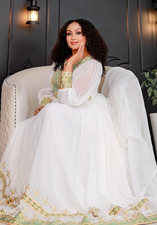 የሐበሻ ቀሚስ |  ጥሬ ኮተን በአረንጓዴ እና ብር የተሠራ ሐበሻ ልብስ