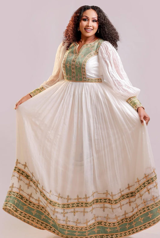 የሐበሻ ቀሚስ |  ጥሬ ኮተን በአረንጓዴ እና ብር የተሠራ ሐበሻ ልብስ