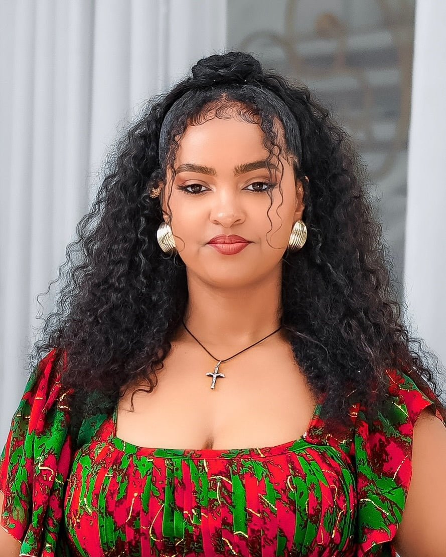 Woman with styled hair wearing Chiffon Habesha dresses 