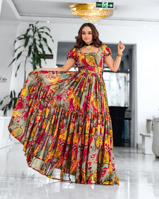 Woman wearing a colorful floral Habesha Chiffon in an indoor setting