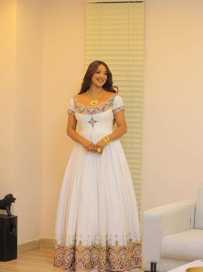 White Habesha Kemis in Handwoven Shemma – Multicolor Geometric Tilf Ethiopian Traditional Dress for Genna & Cultural Events